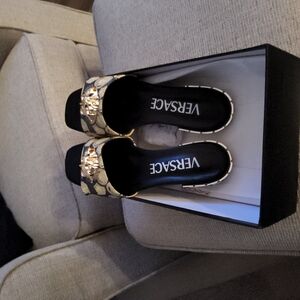 Versace Women's Black and Gold Sandals